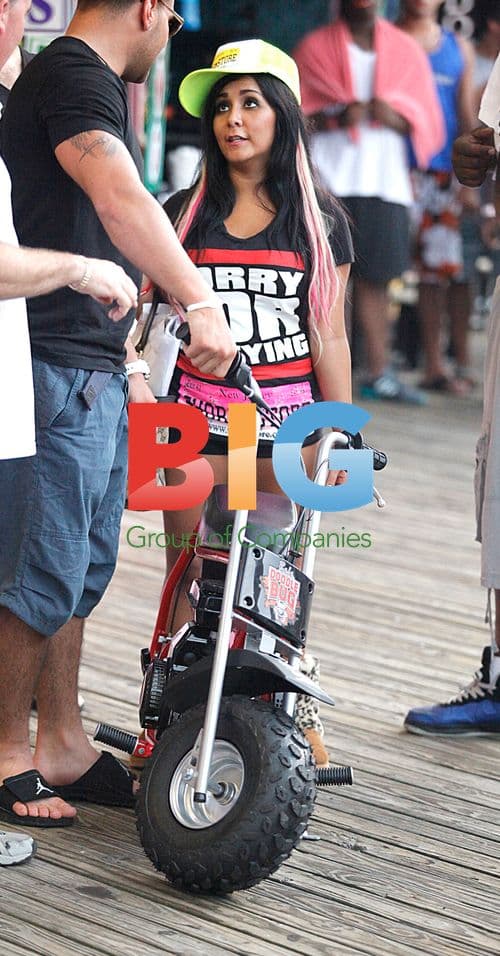 Snooki rides mini motorcycle with Ronnie