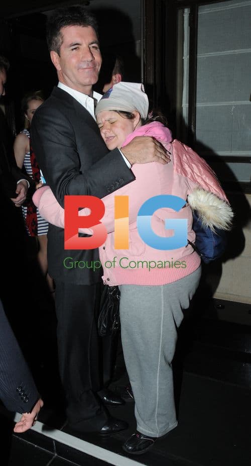 Simon Cowell Embraced by Tania McIntosh