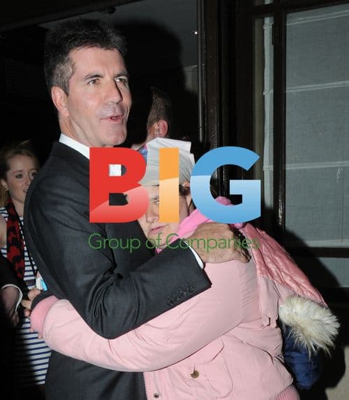 Simon Cowell Embraced in London
