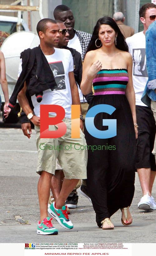 Ashley Cole enjoys summer break with mystery woman