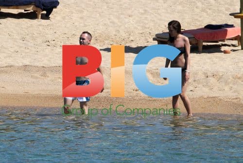 Andres Iniesta and Ana Ortiz on beach in Sardinia