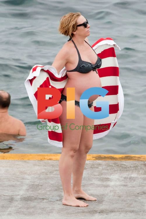 Toni Collette shows off baby bump in Sydney