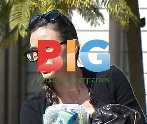 Demi Moore Arrives with Plaited Hair and Vita Coco