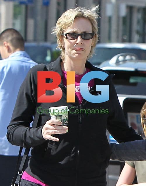 Jane Lynch and partner with dog