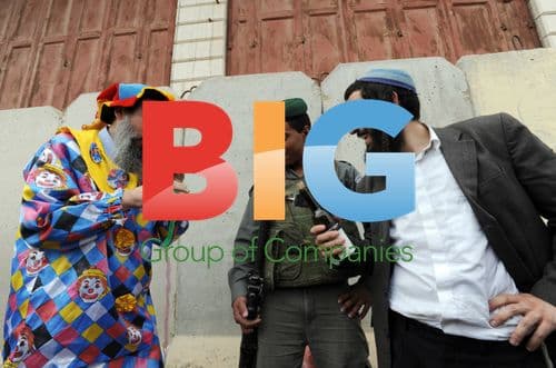 Soldier watches settler at Purim parade in Hebron