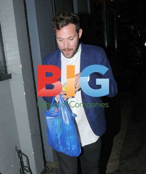 Singer Will Young chats with homeless man in Soho