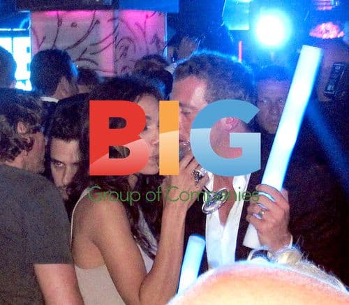 Rosario Dawson and boyfriend at David Guetta party