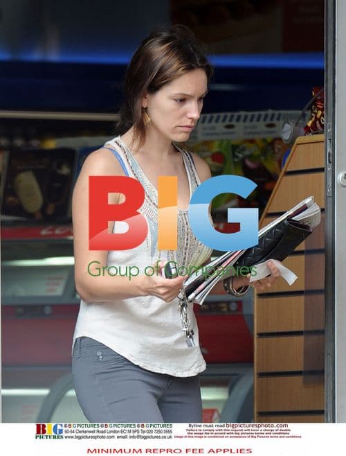 Kelly Brook Getting Morning Papers