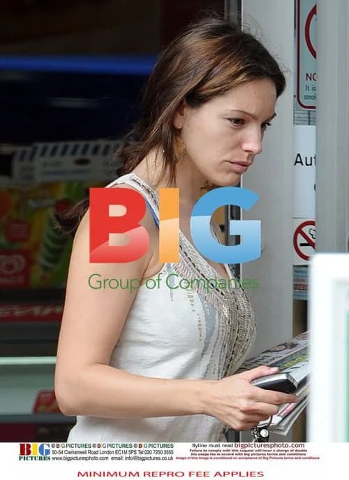 Kelly Brook Gets Morning Papers