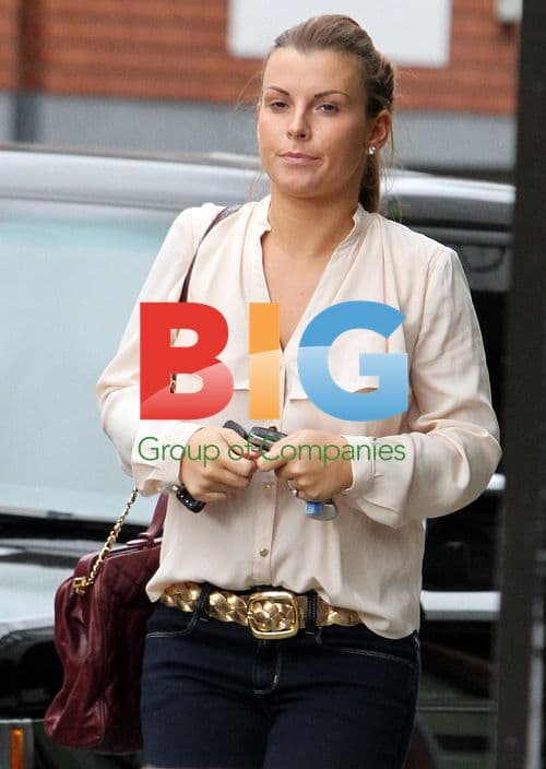 Coleen Rooney Steps Out in Rain for Shoe Shopping