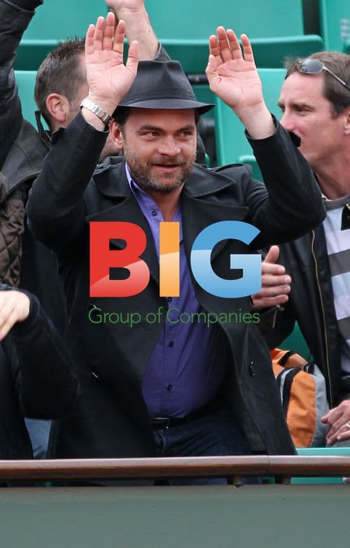 Clovis Cornillac waves during French Open