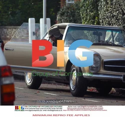 Jason Orange and Catherine Tate leave in vintage car