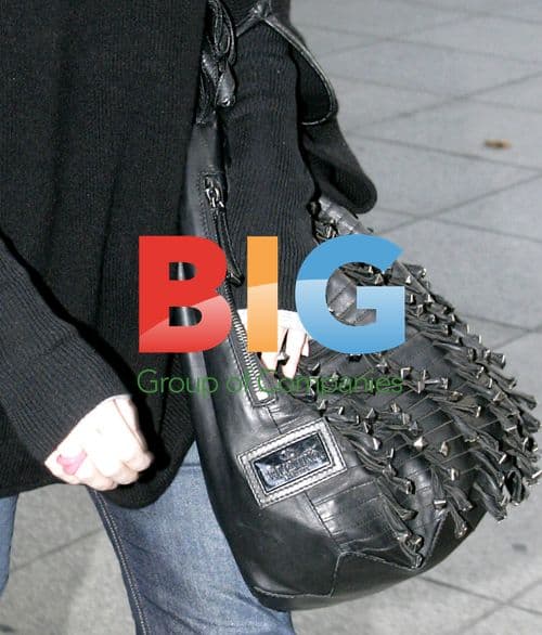 Emma Watson Arrives at Heathrow