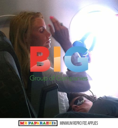 Leandro Penna naps on Katie Price's lap