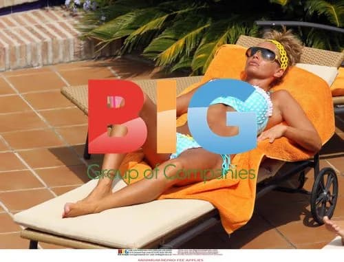 Katie Price Relaxes Poolside in Spain