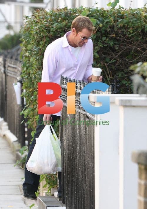 Shane Warne outside Liz Hurley's home