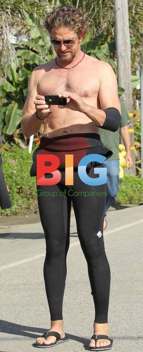 Gerard Butler takes photos on 'Of Men and Mavericks' set