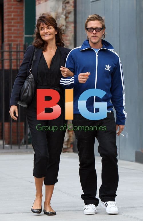 Helena Christensen walking with Paul Banks