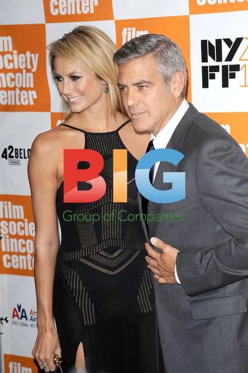Stacy Keibler and George Clooney at The Descendants Premiere