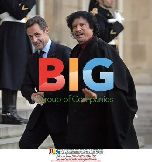 Sarkozy Greets Gaddafi in Paris
