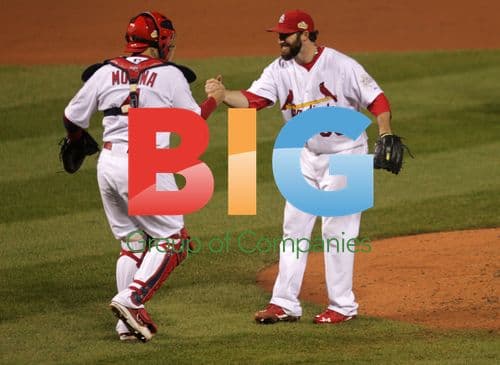 Cardinals' Jason Motte celebrates with Yadier Molina