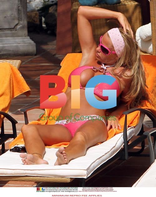 Katie Price Relaxes Poolside in Spain