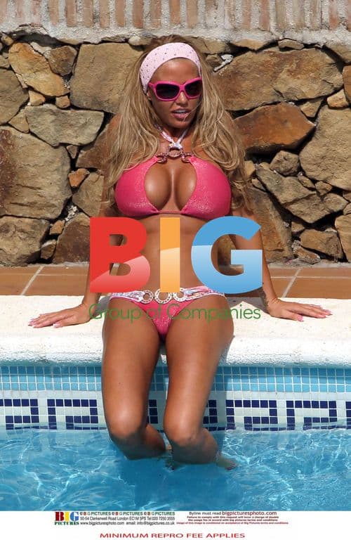 Katie Price Relaxes Poolside in Spain