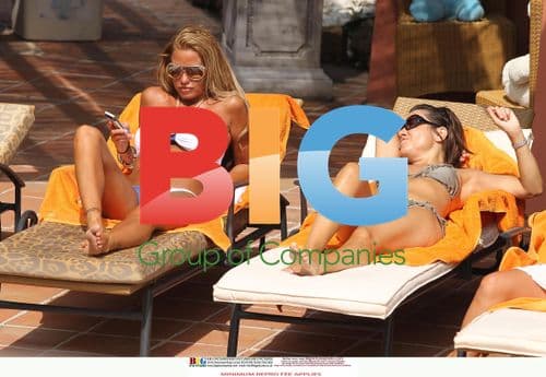 Katie Price Relaxes Poolside in Spain