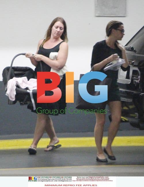 Victoria Beckham Leaves LA Office With Harper