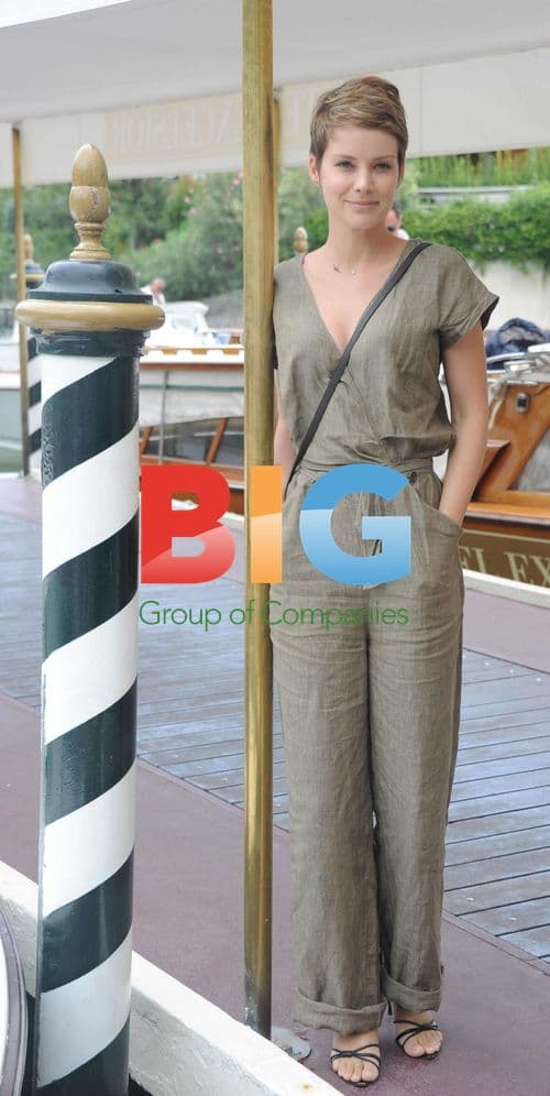 Andrea Osvart takes sea taxi in Venice