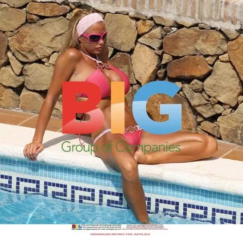 Katie Price Relaxes Poolside in Spain
