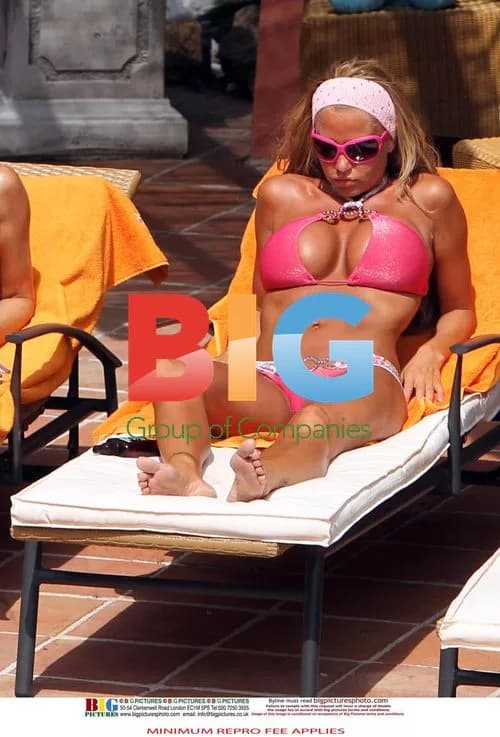 Katie Price in Pink Bikini by Pool in Spain