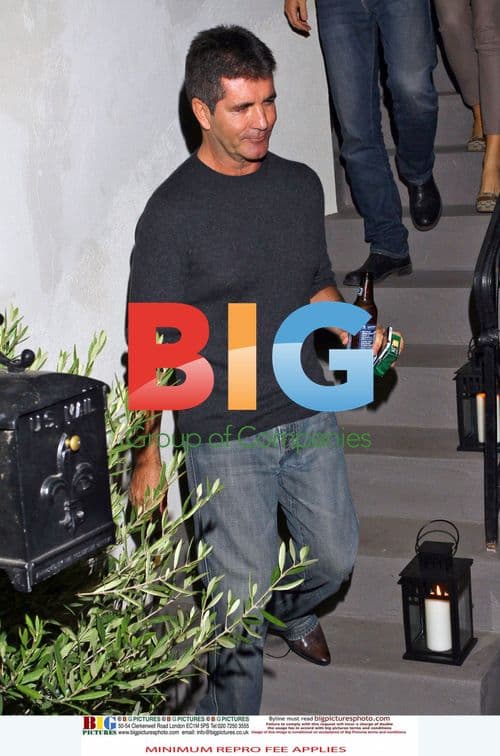 Simon Cowell leaves friend's house with fiance