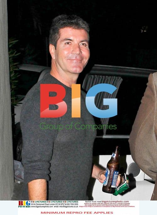 Simon Cowell leaves friend's house with fiance