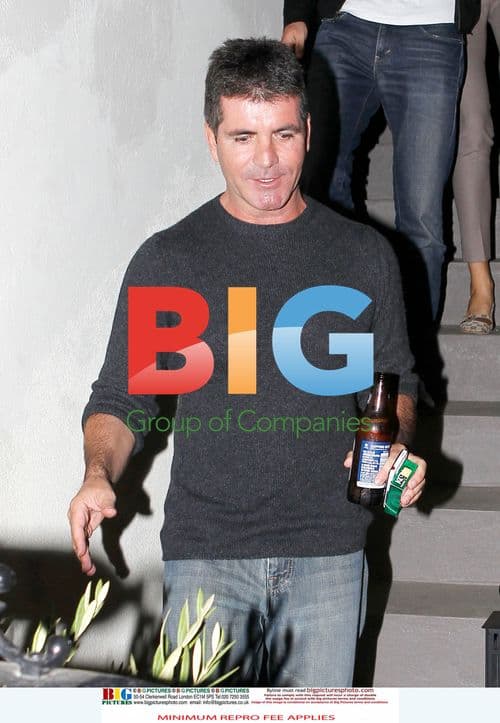 Simon Cowell and fiancée Mezhgan leave friend's house
