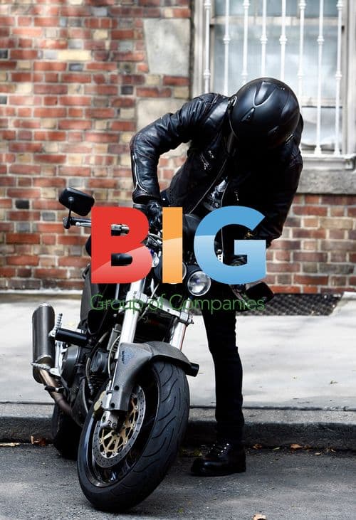 Justin Theroux Arrives on Motorcycle