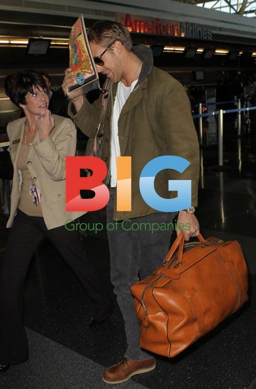 Ryan Gosling Hiding Face at Airport