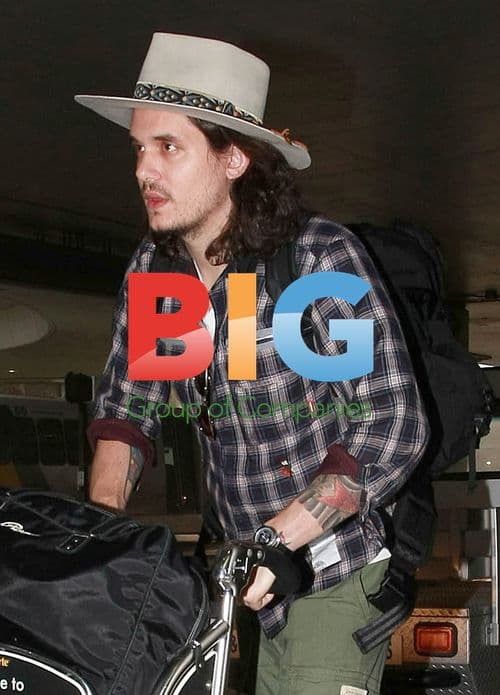 John Mayer Arrives Disheveled at LAX