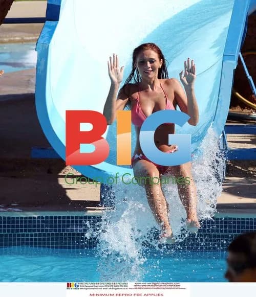 Amy Childs Rides Waterslide in Pink Bikini