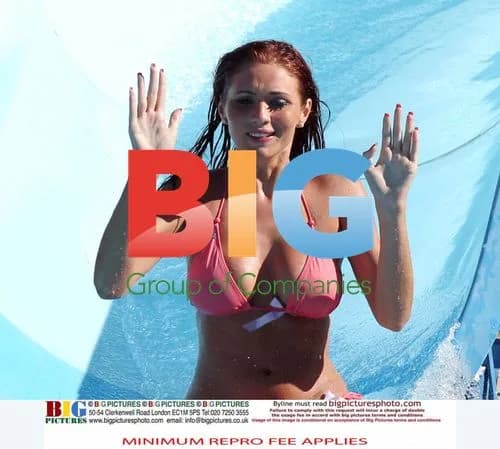 Amy Childs Rides Waterslide in Pink Bikini