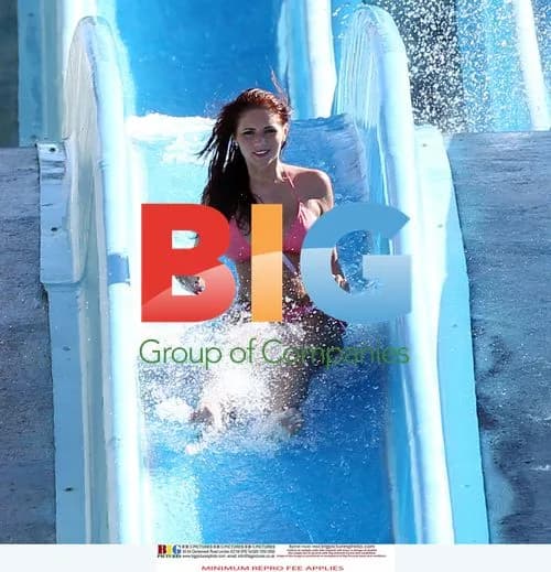 Amy Childs Enjoys Sun in Pink Bikini on Waterslide