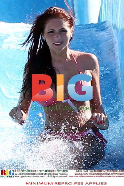 Amy Childs Rides Waterslide in Pink Bikini