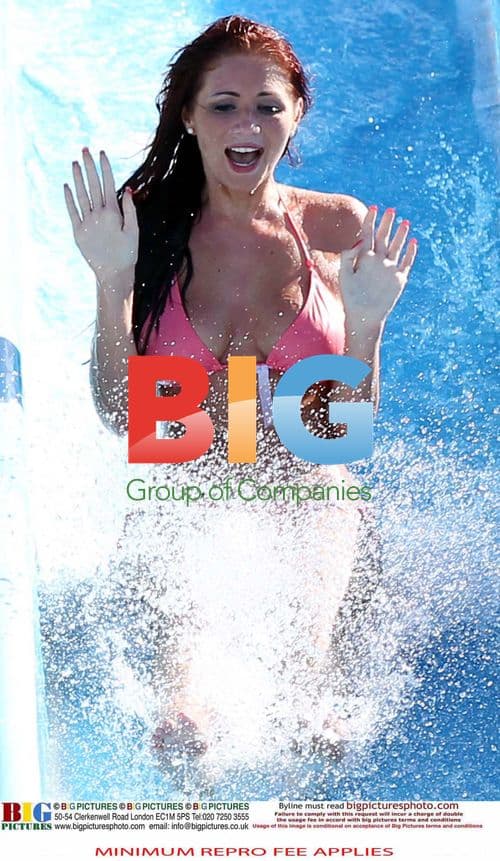 Amy Childs Enjoys Waterslide in Pink Bikini