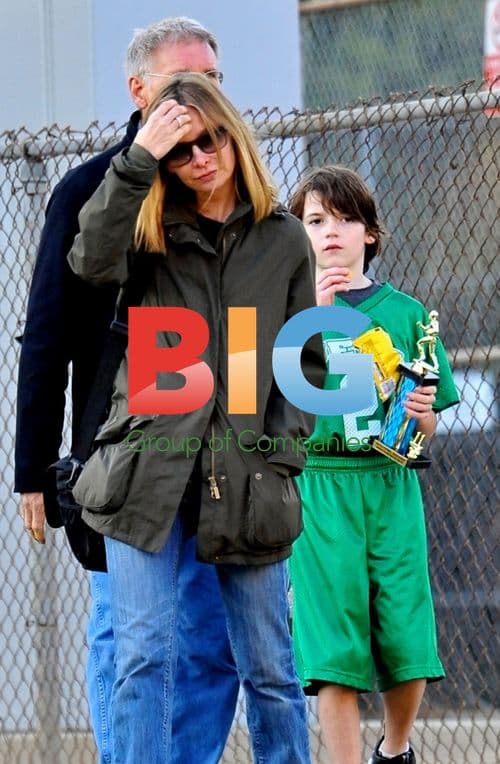 Harrison Ford and Calista Flockhart at son's football game
