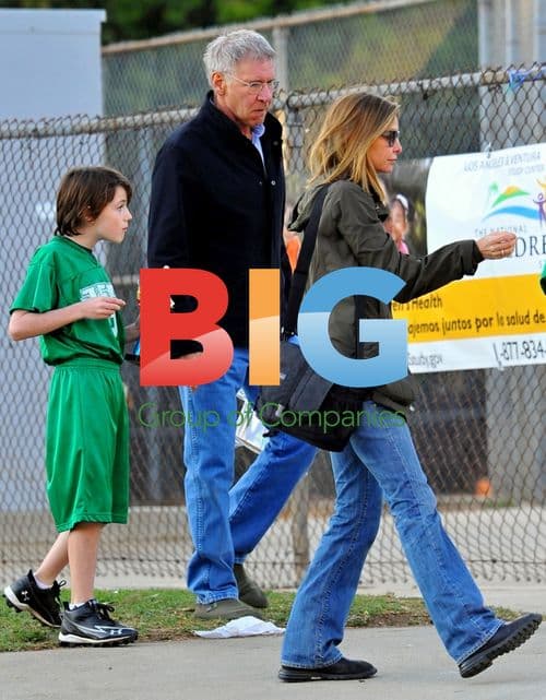 Harrison Ford and Calista Flockhart at son's football game