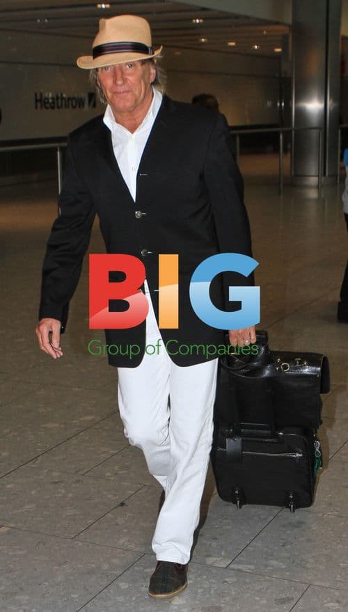 Rod Stewart and family arrive at Heathrow