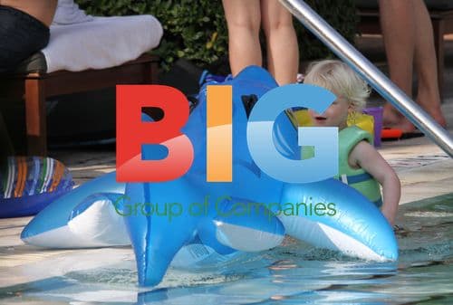 Sharlely Becker and son Amadeus play in pool