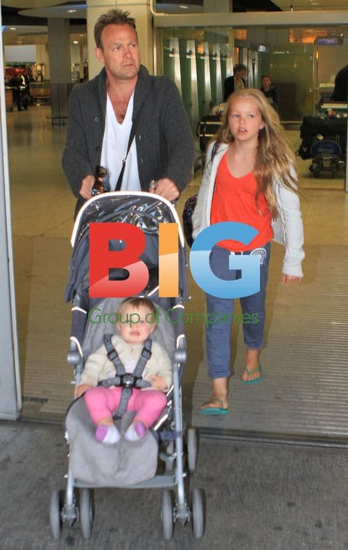 Jason Donovan with children at Heathrow