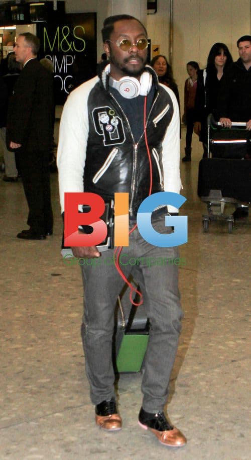 Will.i.Am Arrives at Heathrow Airport
