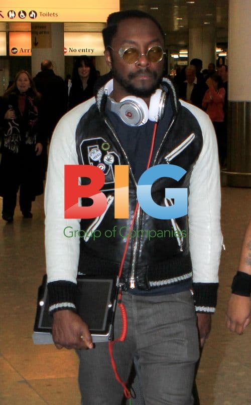 Will.i.Am Arriving at Heathrow Airport